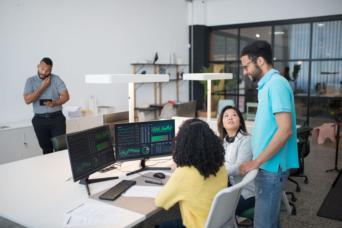 Team working together in a bright open-plan office
